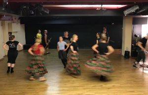 Polish dancers spin around each other.