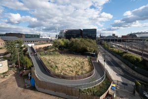 A photo looking down on a path curving away.