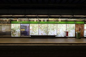 A photo of the side of a metro platform, taken from the opposite side.