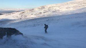 Very strong winds as Chris descends Coire an Lochan.