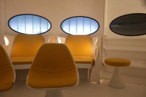 A detail of yellow padded seating inside Futuro house.