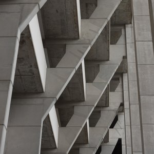 Looking up at a series of concrete supports.