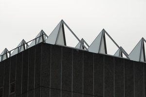 A close shot of the roof of the Hayward gallery. The roof is covered in metal and glass pyramids to capture light.