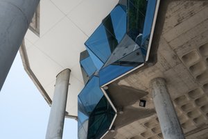 Looking up at a series of angled windows from a lookout.