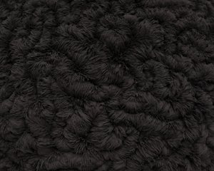 A close macro of the artwork, showing a detailed texture made from iron filings. The texture is made from iron filings attracted to the sphere.