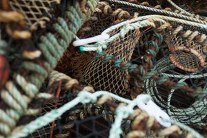 A detail photo of some fishing nets and lobster pots.
