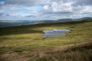 A small tarn in an otherwise featureless landscape.