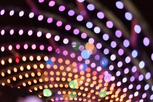 The frame is filled with circles of light in an arc pattern. The colours vary from deep oranges to light lilac.