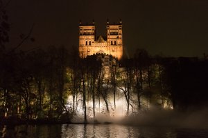 Durham Cathedral at night, shot from the opposite bank of the river. The trees below are full of white mist.