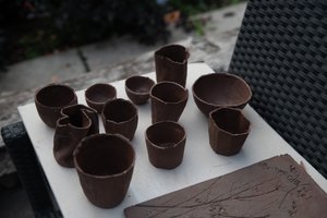 A group of freshly made slip-casts, drying on a table.