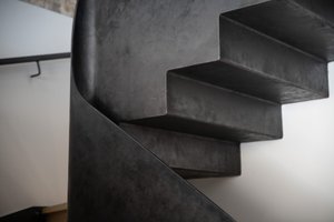 A detail shot of a metal staircase.