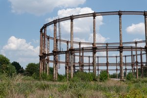 A gas work from afar, showing the railings curving round. Another gas work is visible in the distance.