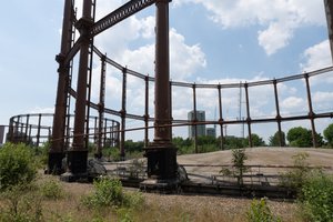 A photo of two gas works, taken near to one. The floor of the dome of the nearest works is visible.