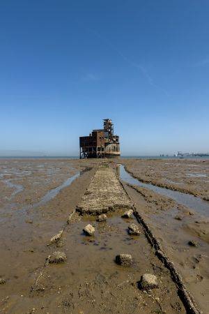 Exterior photo of the battery taken from afar, straight on pointing along the path to it.