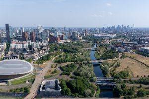 Looking over the olympic park with the velodrome in foreground and stadium in background.