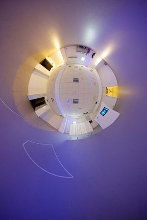 Reverse stereographic panorama of a purple room.