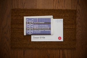 Photo of a PaperLater newspaper on a doormat.